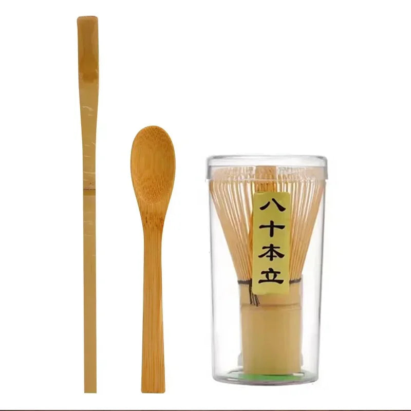A set of traditional bamboo and ceramic matcha tea tools including a bamboo whisk and a ceramic tea bowl.