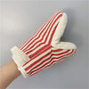 A pair of red and white striped insulated kitchen baking gloves shown on a hand.