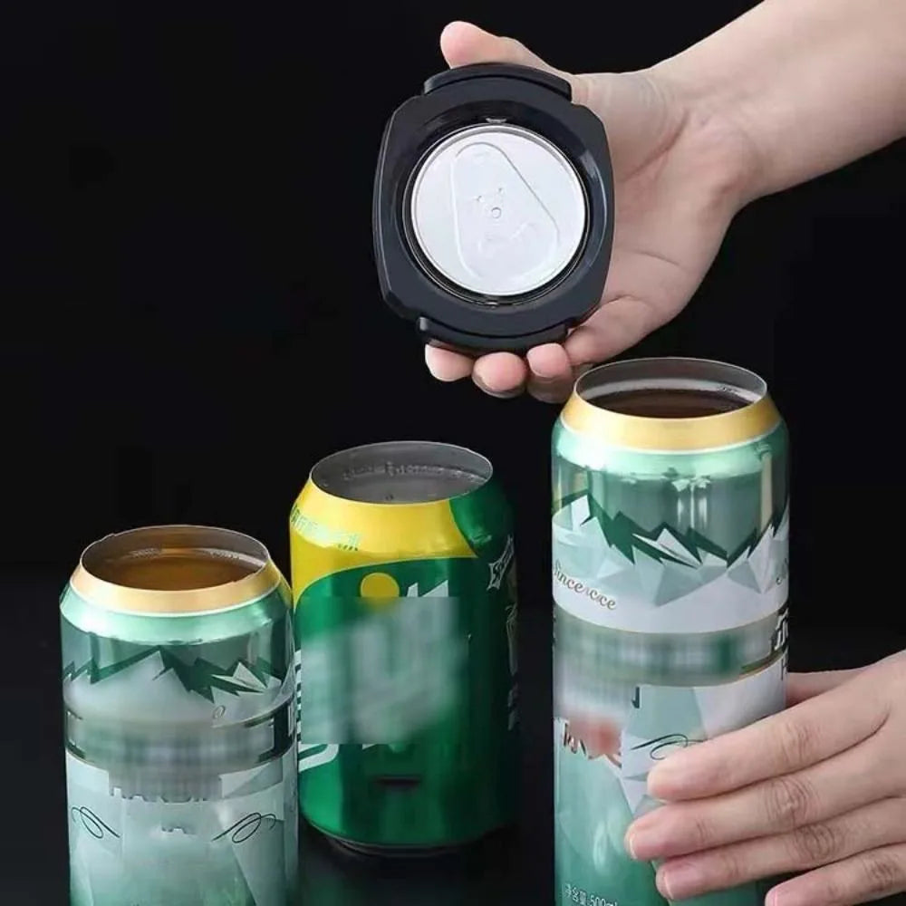 A hand holds a black 2-in-1 beverage opener and corkscrew tool next to two green and yellow beverage cans.
