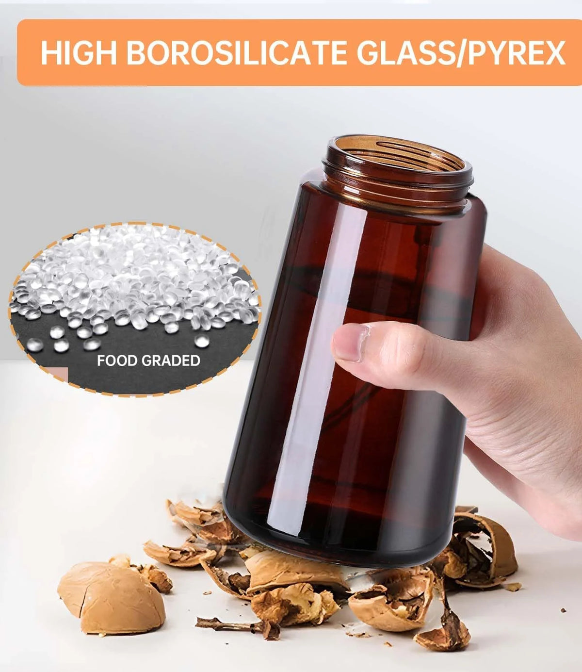 A hand holds a dark brown borosilicate glass pyrex oil dispenser with a white pipette, next to dried plant material.