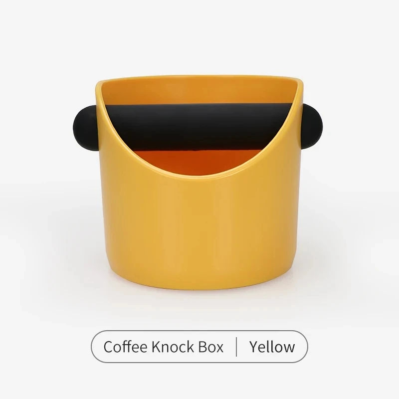 A yellow coffee knock box with a black interior, shown from the side.