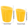 A yellow flexible silicone measuring cup shown with various size markings and dimensions.